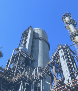 Large industrial silos at a plant, an environment where FiberElectronics provides robust fiber connectivity for industrial control networks.